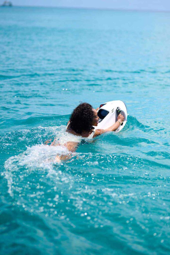 Person snorkeling in clear blue ocean