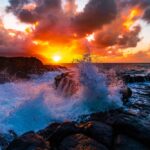 A beautiful scenery of rock formations by the sea at Queens Bath, Kauai, Hawaii at sunset