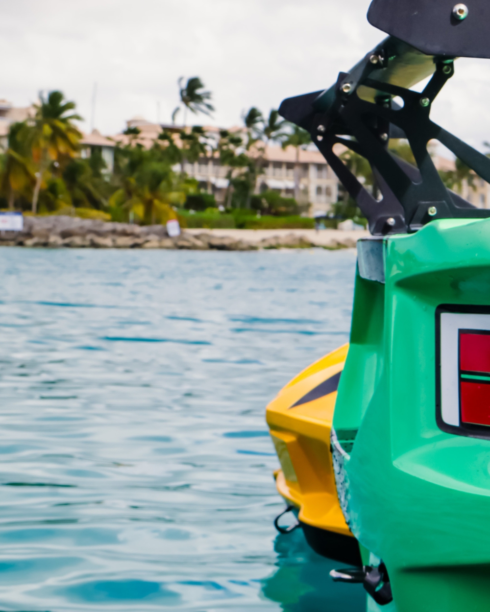 Jet ski docked by tropical coast, blurred background