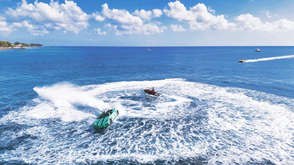 Speedboats creating waves in clear blue ocean