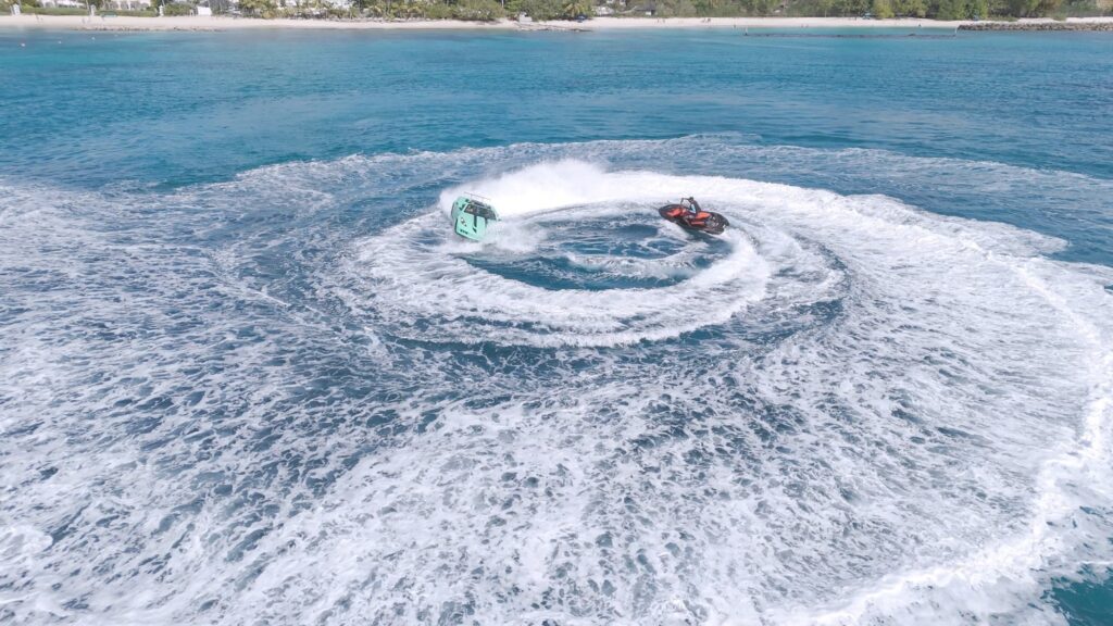 Jet skis making circular waves in tropical sea