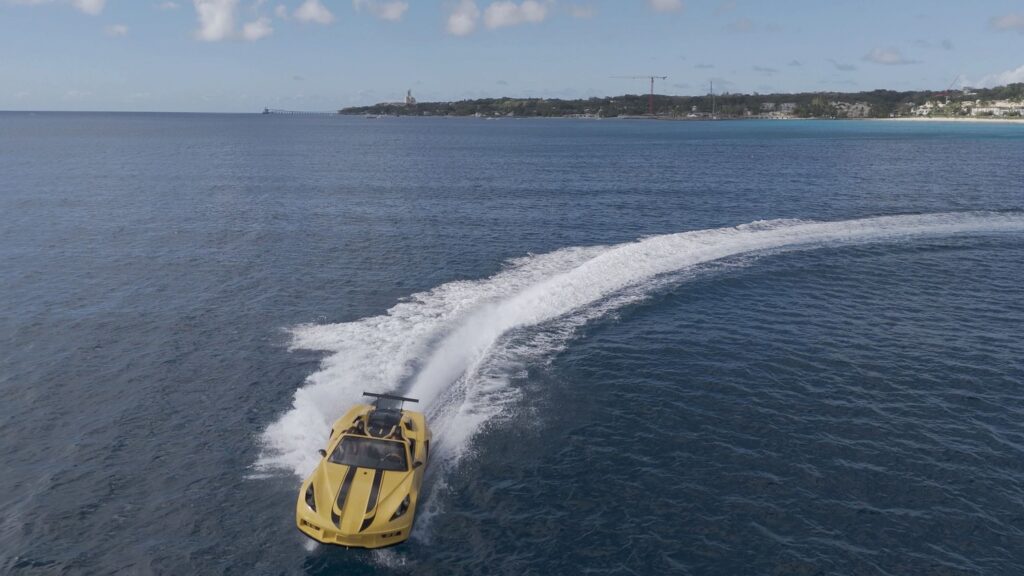 Yellow speedboat cruising on blue ocean